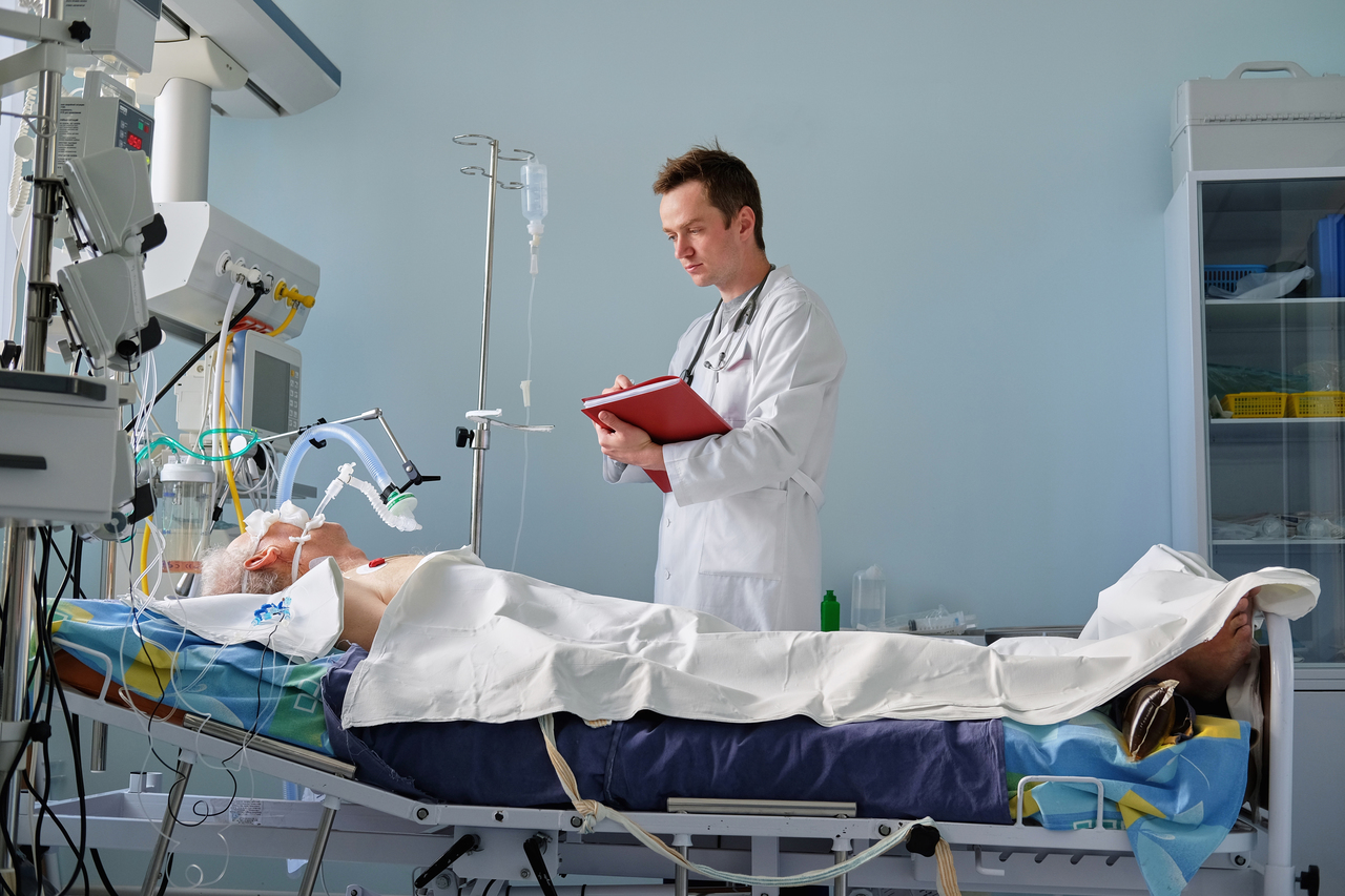 A man on a medical ventilator due to COVID-19