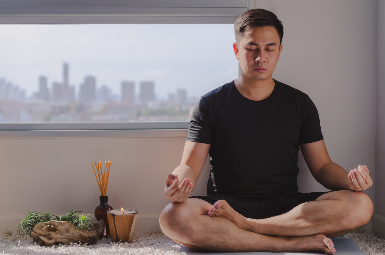 A man meditating to reduce stress