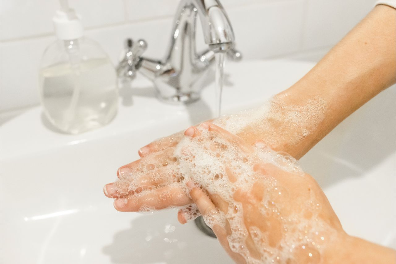 A person washing hands