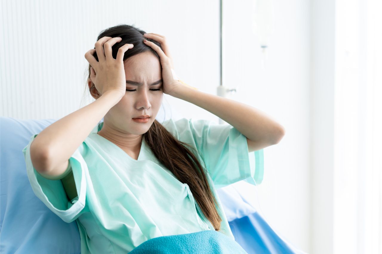 Woman in a hospital bed
